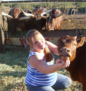 Katelyn chin scritching the baby. (Hethcox family)